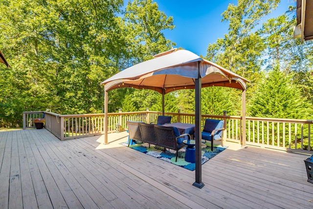 wooden terrace featuring a gazebo