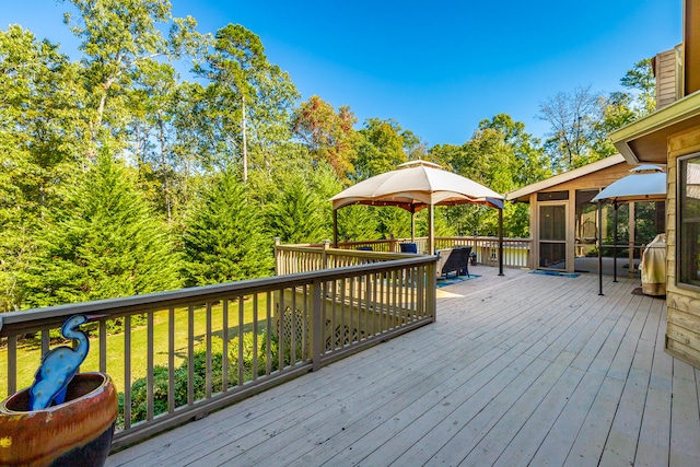 wooden deck featuring a sunroom