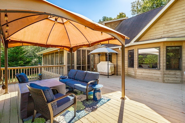 wooden deck featuring a gazebo