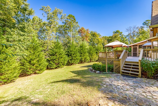 view of yard with a gazebo and a deck