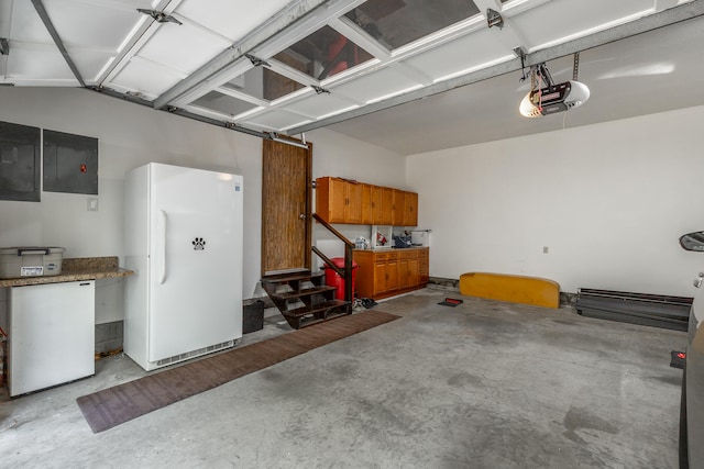 garage featuring white fridge, a garage door opener, and electric panel