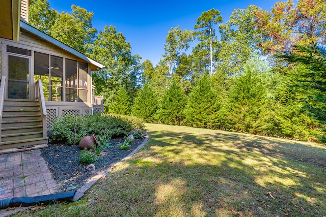 view of yard featuring a sunroom