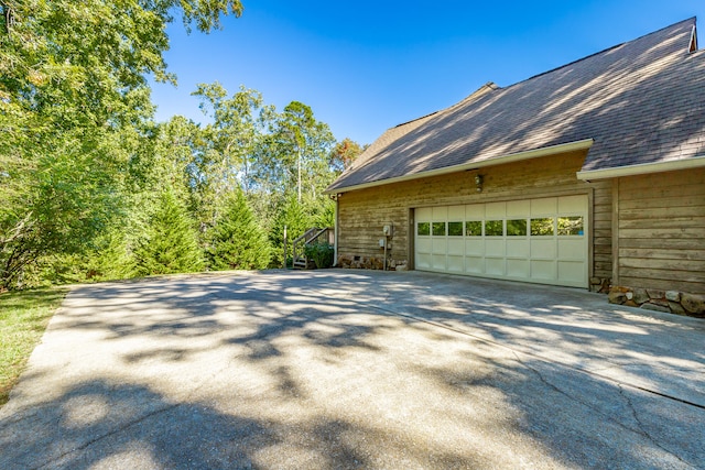 view of side of home with a garage