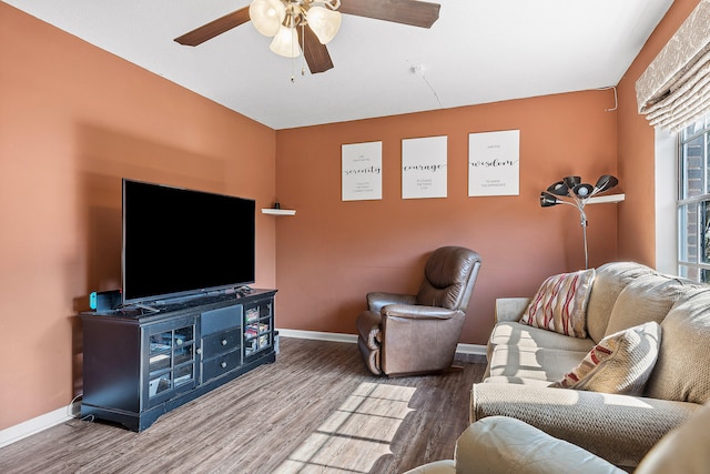 living room featuring ceiling fan and wood-type flooring