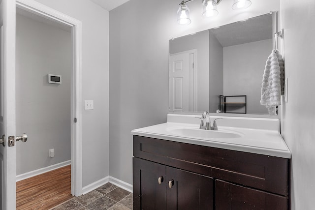 bathroom featuring vanity and hardwood / wood-style flooring