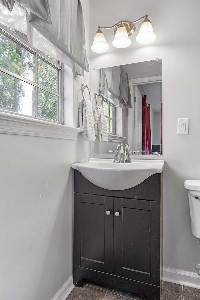 bathroom with vanity and toilet