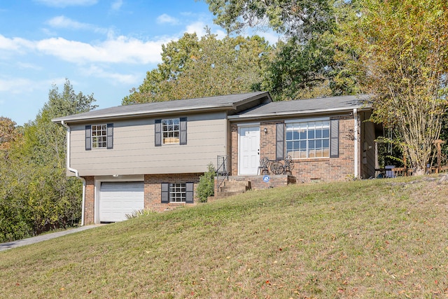 view of front of house featuring a garage and a front lawn