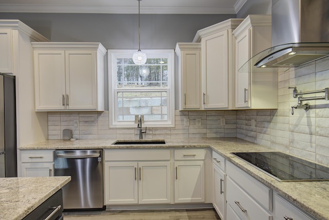 kitchen featuring white cabinets, sink, wall chimney exhaust hood, and appliances with stainless steel finishes