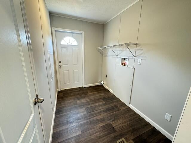 clothes washing area with laundry area, hookup for a washing machine, baseboards, ornamental molding, and dark wood finished floors