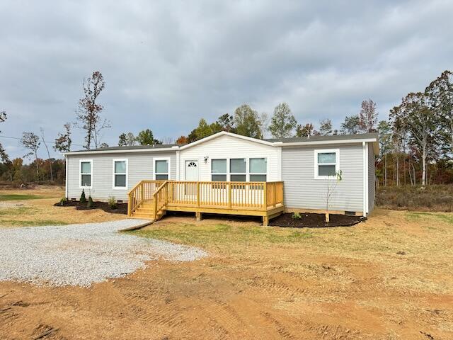 view of front of property featuring a wooden deck