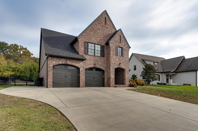 view of front of house featuring a front yard and a garage