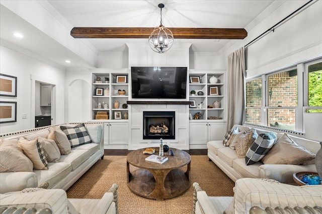 living room with beam ceiling, ornamental molding, an inviting chandelier, and hardwood / wood-style floors