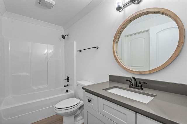 full bathroom with vanity, toilet, hardwood / wood-style flooring, and bathing tub / shower combination