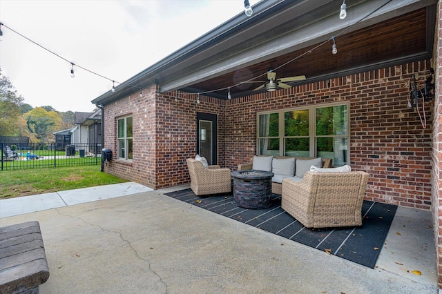 view of patio / terrace with an outdoor living space and ceiling fan