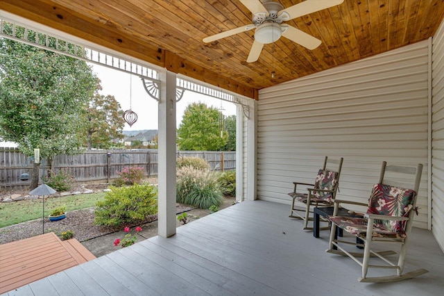 exterior space with a deck and ceiling fan