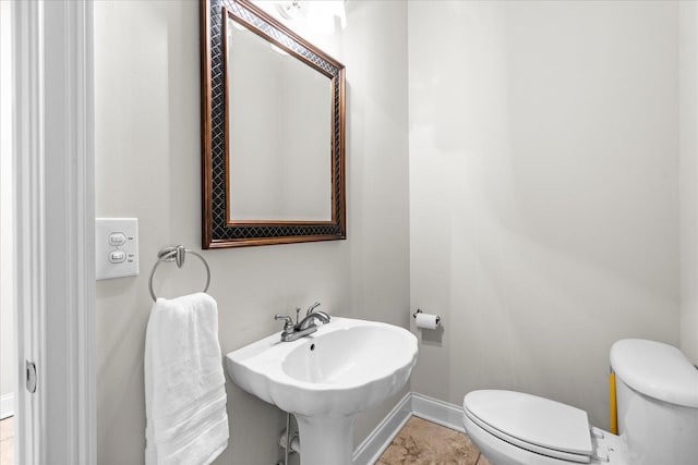 bathroom with sink and toilet