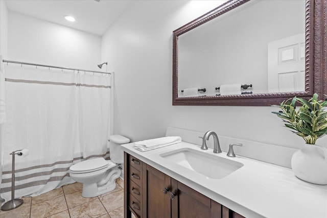 bathroom with a shower with curtain, tile patterned floors, vanity, and toilet