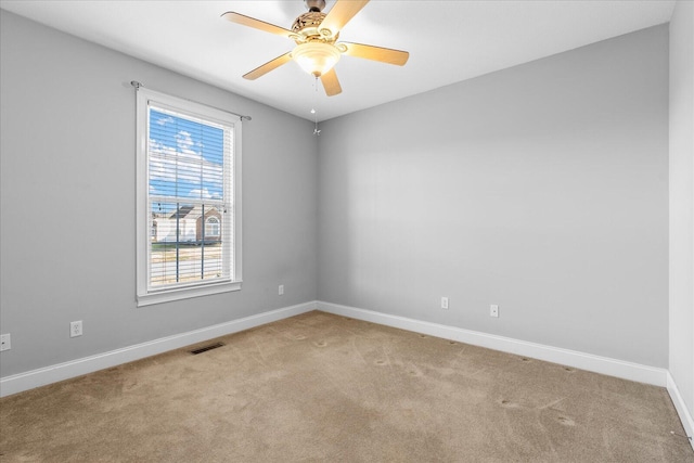 empty room with light carpet and ceiling fan