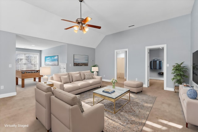 living room with lofted ceiling, light colored carpet, and ceiling fan