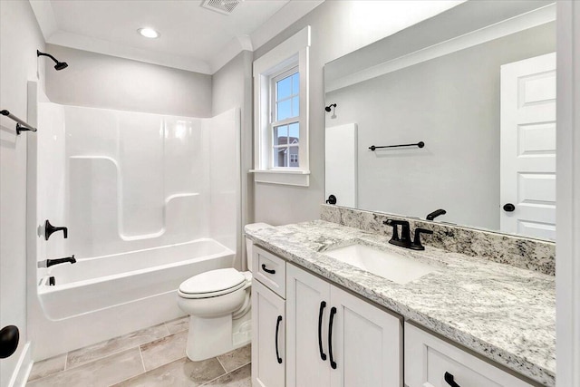 full bathroom with vanity, crown molding, bathing tub / shower combination, and toilet