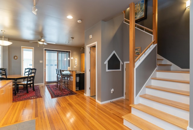 interior space with hardwood / wood-style flooring and ceiling fan