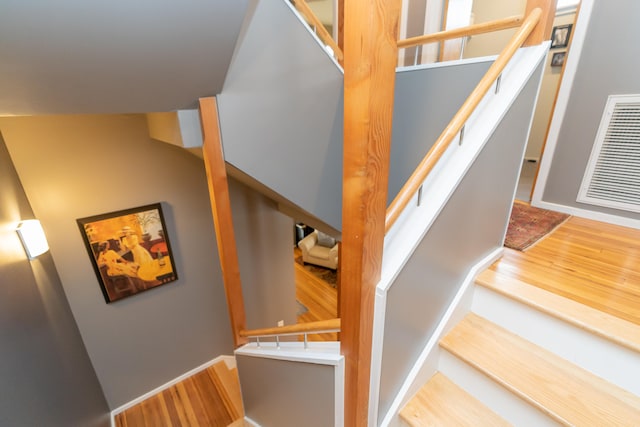 staircase featuring hardwood / wood-style floors