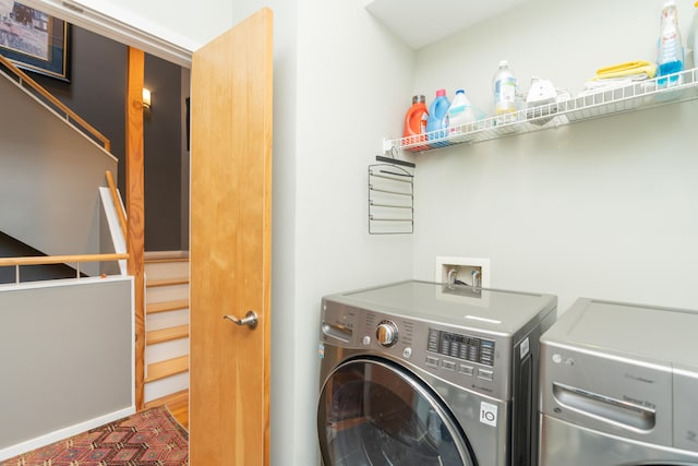 clothes washing area featuring washing machine and clothes dryer