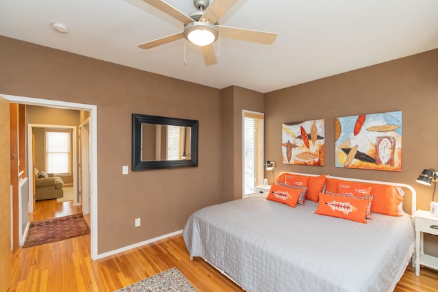 bedroom featuring ceiling fan and light wood-type flooring