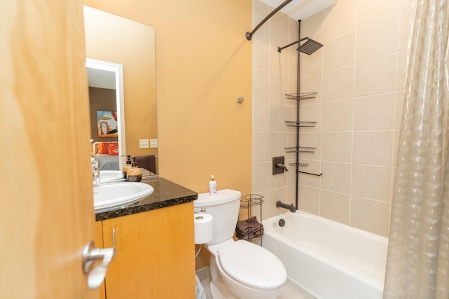 full bathroom with vanity, toilet, and shower / tub combo