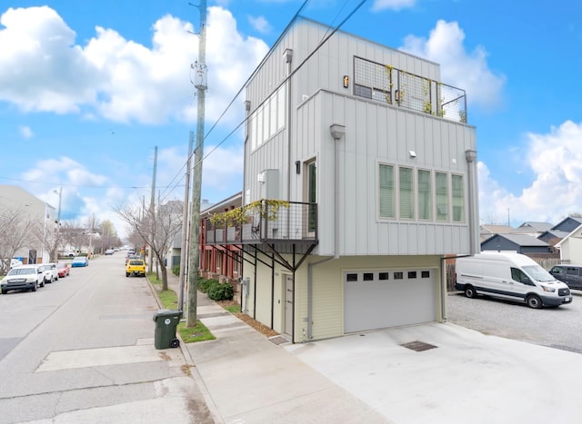 view of side of home featuring a garage