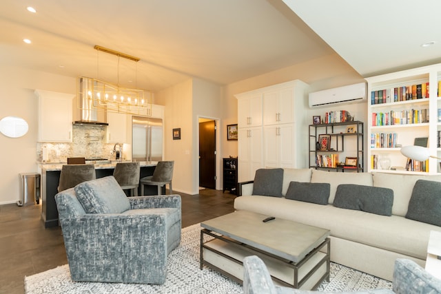 living room with a wall mounted air conditioner, a notable chandelier, and concrete flooring