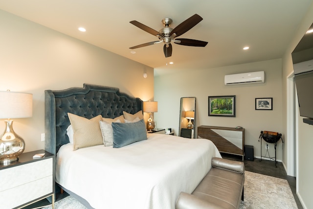 bedroom with a wall mounted air conditioner and ceiling fan