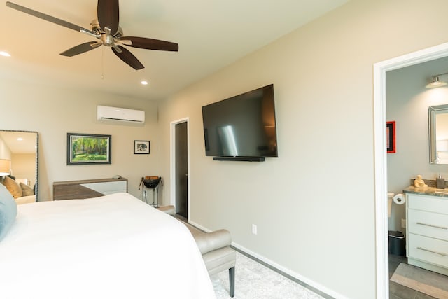 bedroom with a wall unit AC and ceiling fan