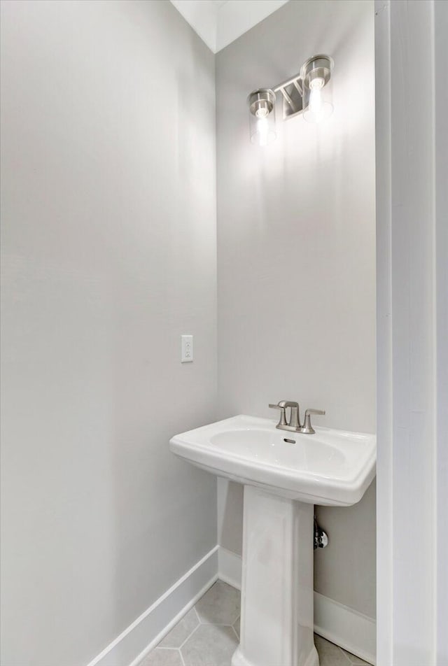 bathroom featuring sink and tile patterned flooring