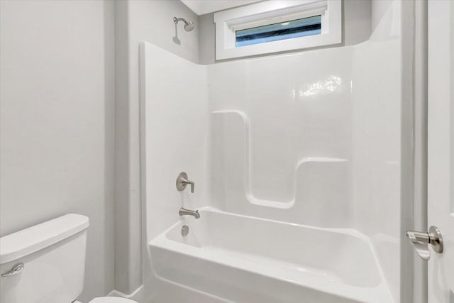 bathroom with toilet and shower / bathtub combination