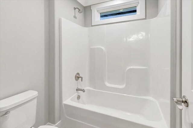 full bathroom featuring shower / tub combination and toilet