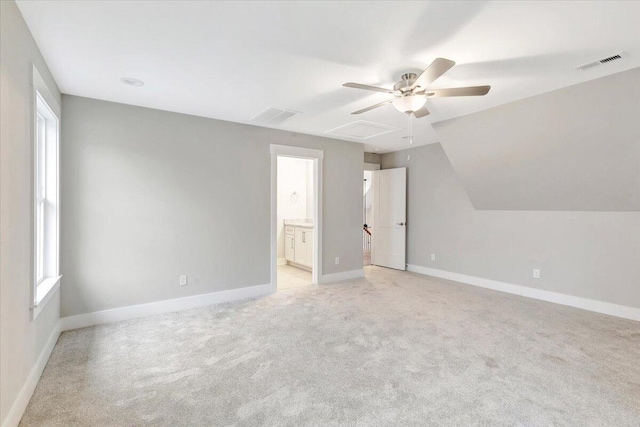 bonus room featuring light colored carpet, vaulted ceiling, and ceiling fan