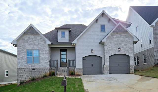 view of front of property with a garage and a front lawn