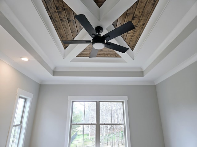 room details with crown molding, ceiling fan, and wood ceiling