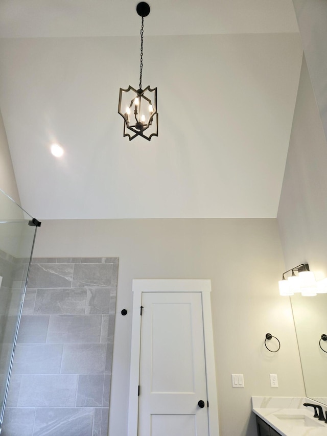 bathroom featuring vanity and a notable chandelier