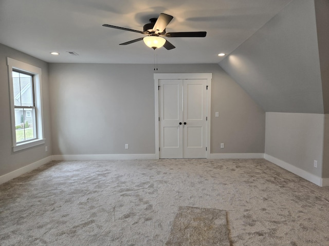 bonus room featuring ceiling fan, carpet, and lofted ceiling