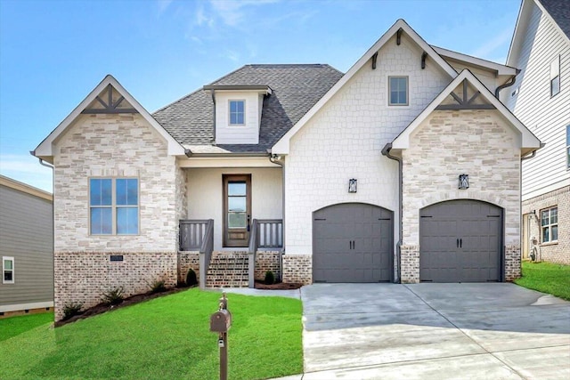 view of front of house featuring a garage and a front yard