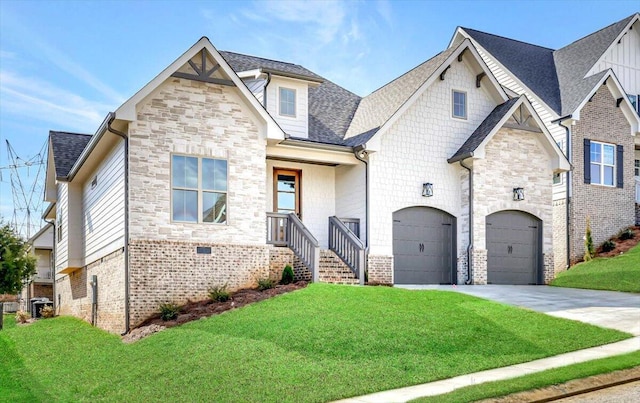 view of front of property featuring a garage and a front lawn