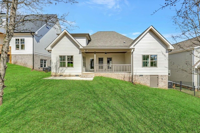 rear view of house featuring a yard, central AC, and ceiling fan