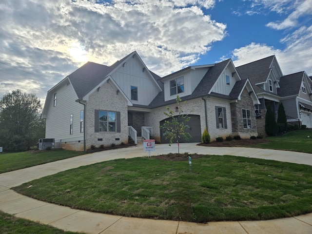 craftsman house with central AC, a front yard, and a garage