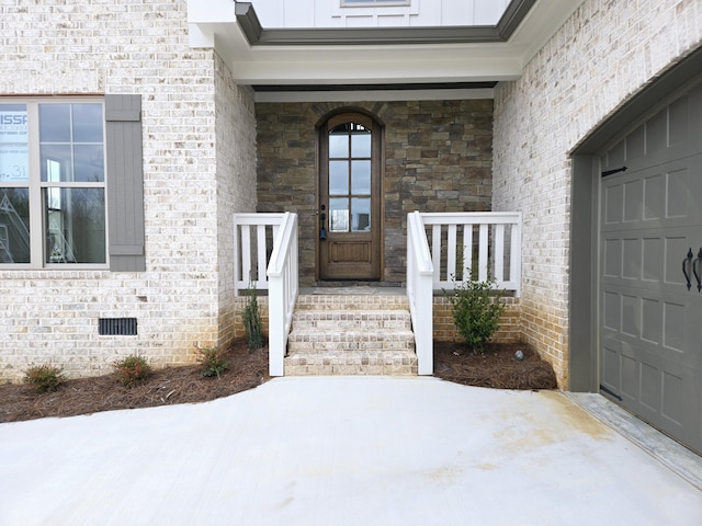 property entrance featuring a garage