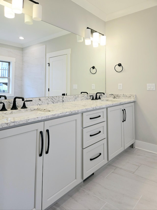 bathroom featuring vanity and crown molding