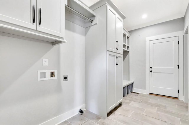 washroom featuring cabinets, hookup for an electric dryer, and hookup for a washing machine