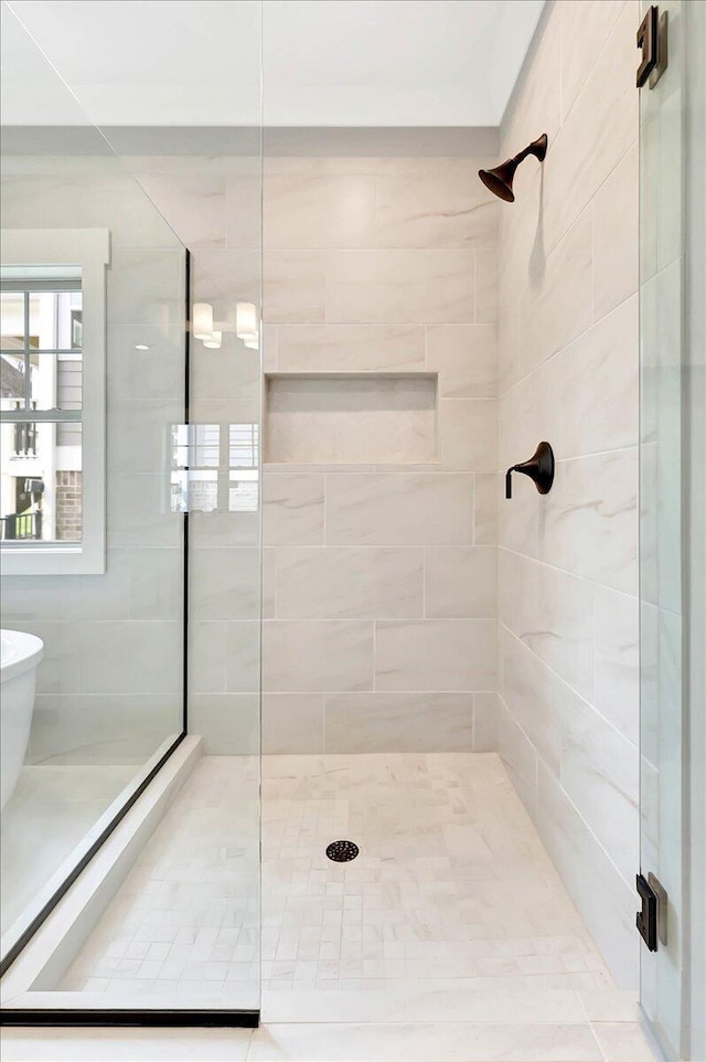 bathroom featuring an enclosed shower