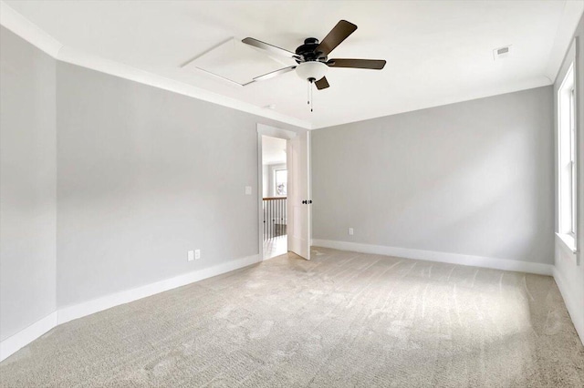 carpeted empty room featuring crown molding and ceiling fan